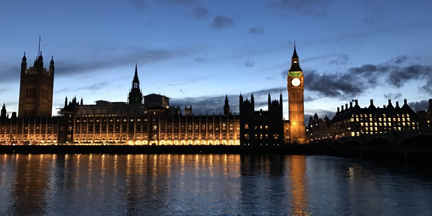 An evening photo of the House of Commons, from across the Thames