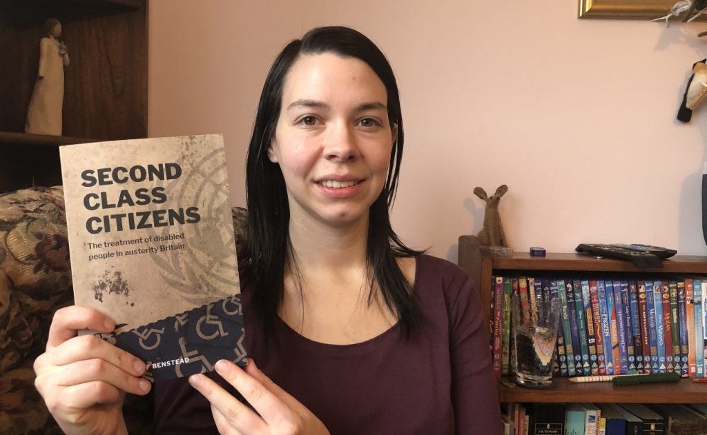 Stef Benstead with a copy her book, Second Class Citizens, which looks at the way the UK has breached disabled people's human rights