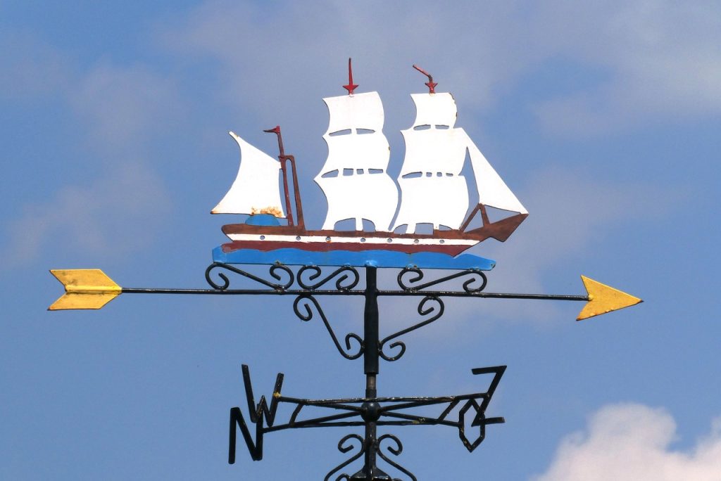 A weather vane in the shape of a sailing ship