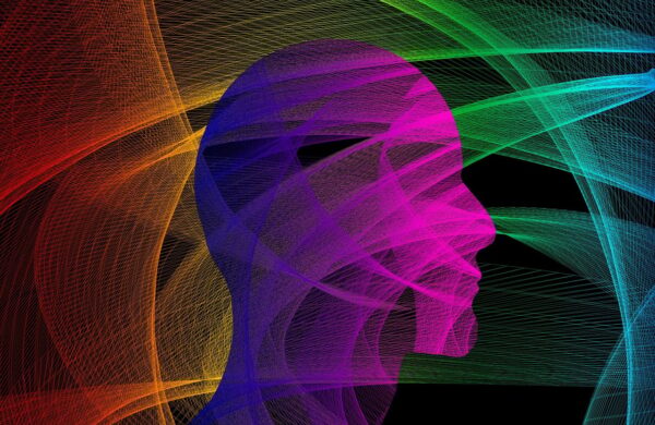 A silhouette head, with multiple coloured lines criss-crossing