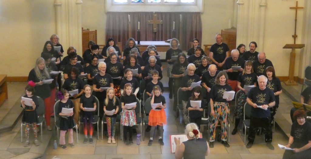 A shot from upstairs of the choir singing in St Mary's Bramall Lane