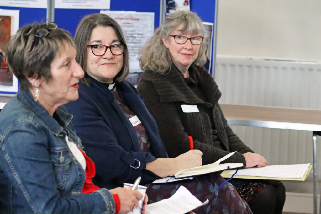 Three women sitting beside each other at the North East Roundtable
