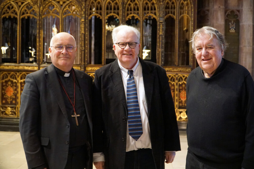 Three men standing in Manchester Cathedral: The Archbishop of York, and authors Joseph Forde and Terry Drummond.