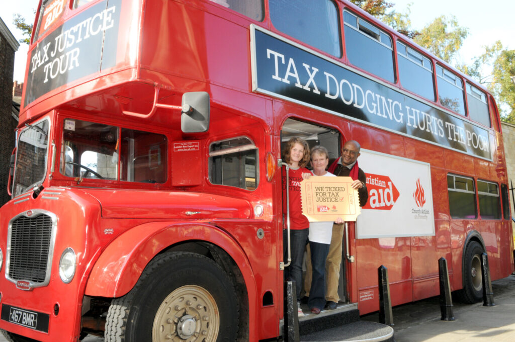 A traditional red double decker bus, for the tax justice tour